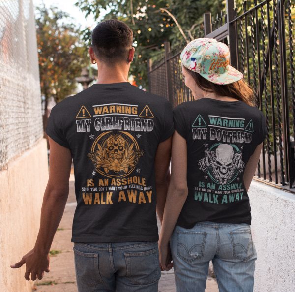 couple-walking-in-a-hall-wearing-round-neck-tees-mockup-from-the-back-a13493.png